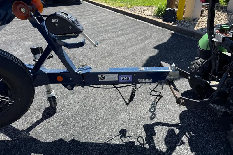Slide: The Image of Trailer hitch of a 2021 MasterCraft XT21 boat, connected to a vehicle. - 35