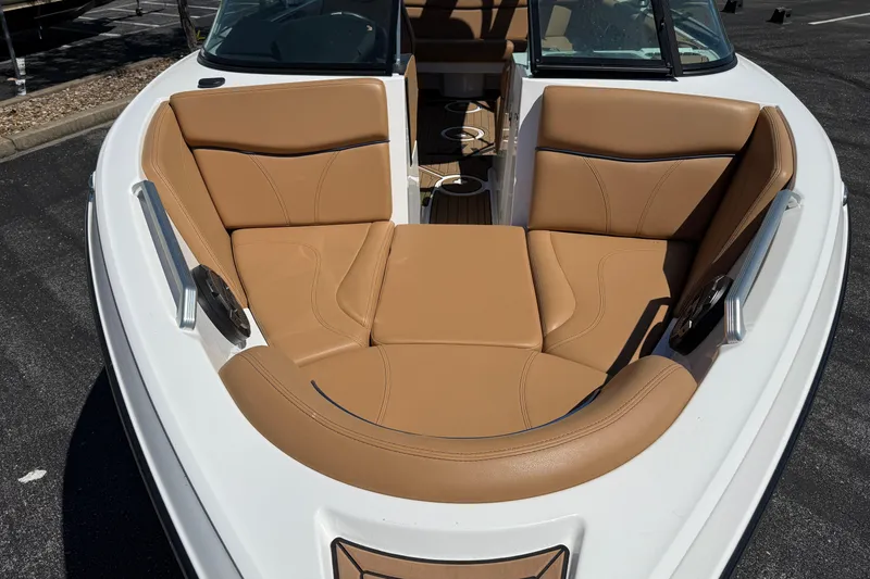Slide: The Image of 2021 MasterCraft XT21 boat with tan leather seating in the bow area. - 36