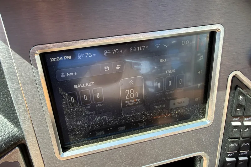 Slide: The Image of 2021 MasterCraft XT21 dashboard display showing ballast and ski settings. - 43