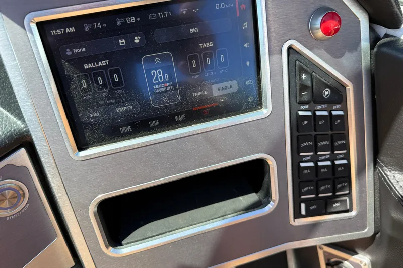 Slide: The Image of Control panel of a 2021 MasterCraft XT21 boat, featuring digital display and buttons. - 22