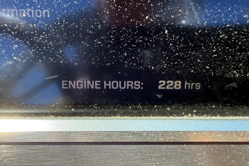 Slide: The Image of Dashboard display showing 228 engine hours on a 2021 MasterCraft XT21 boat. - 10