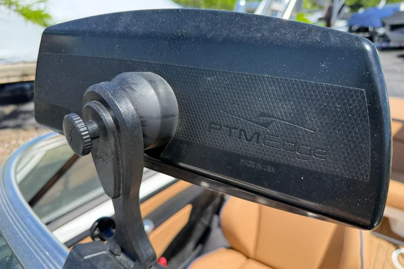 Slide: The Image of Rearview mirror of 2021 MasterCraft XT21 boat with PTM Edge branding. - 12