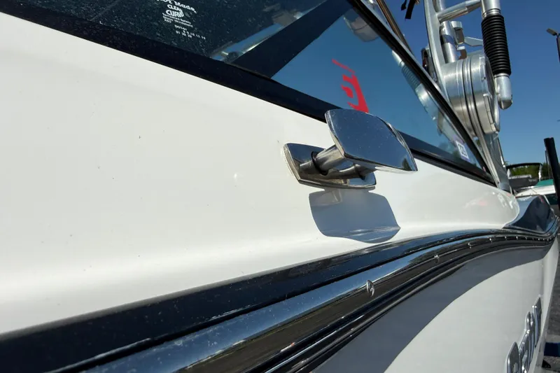 Slide: The Image of 2021 MasterCraft XT21 boat detail, showcasing sleek design and chrome accents. - 38