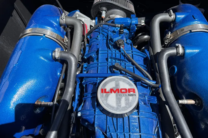 Slide: The Image of Ilmor 6.0L MPI engine in a 2021 MasterCraft XT21 boat, showcasing blue components. - 26