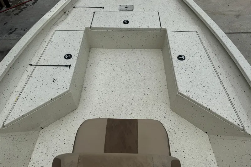 Slide: The Image of 2020 Xpress H22B Bay boat interior with storage compartments and seating. - 12
