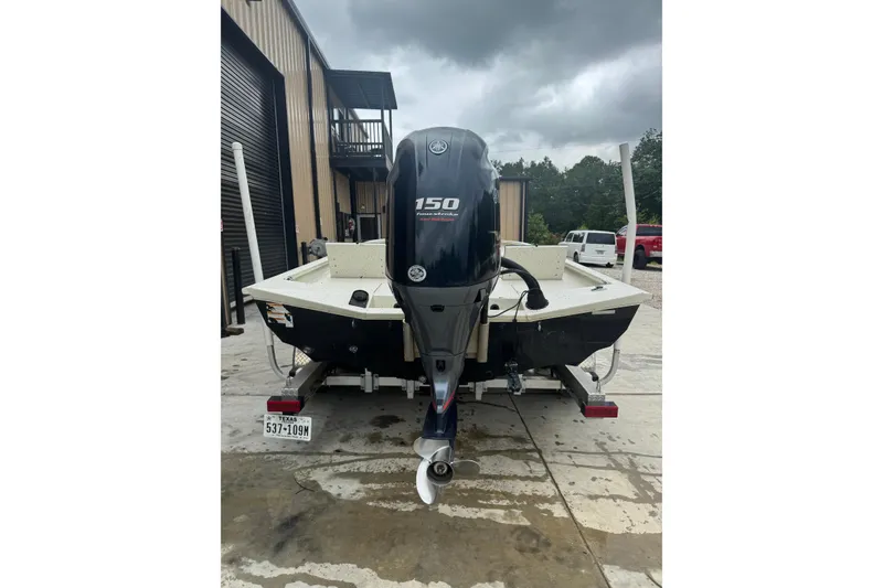 Slide: The Image of 2020 Xpress H22B Bay boat with 150 horsepower engine, parked outdoors. - 21