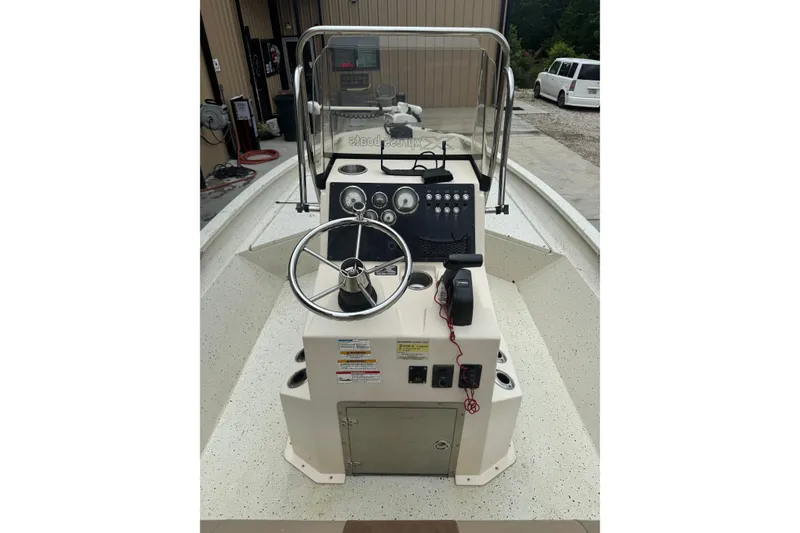 Slide: The Image of 2020 Xpress H22B Bay boat console with steering wheel and controls. - 17