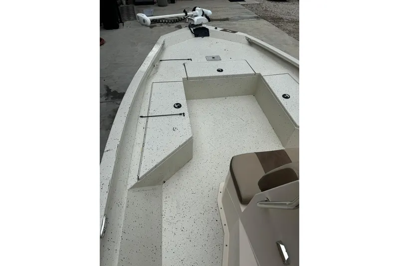 Slide: The Image of 2020 Xpress H22B Bay boat interior with storage compartments and seating. - 10