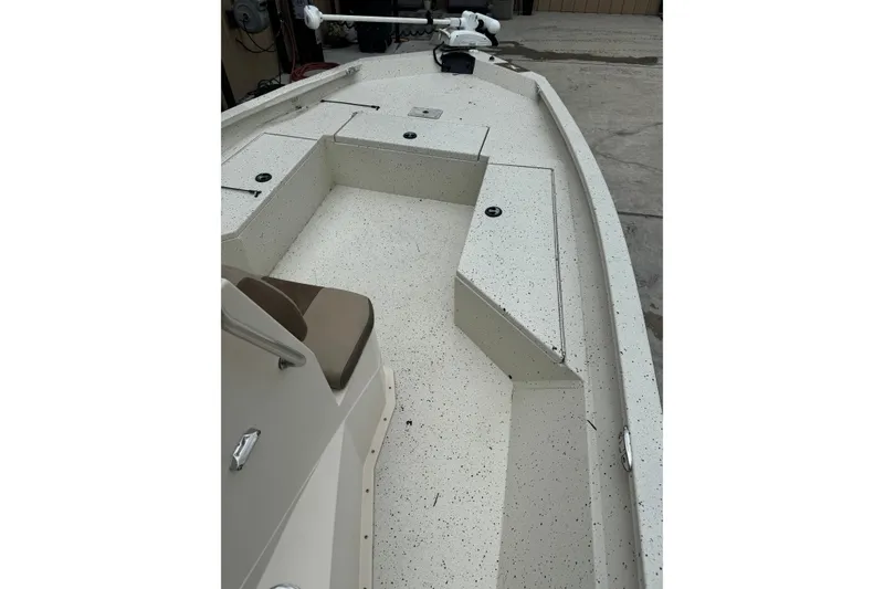 Slide: The Image of 2020 Xpress H22B Bay boat interior with speckled flooring and seating. - 11