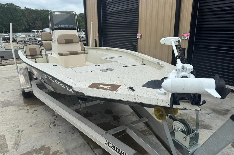 Slide: The Image of 2020 Xpress H22B Bay boat on trailer, parked outside a storage facility. - 9