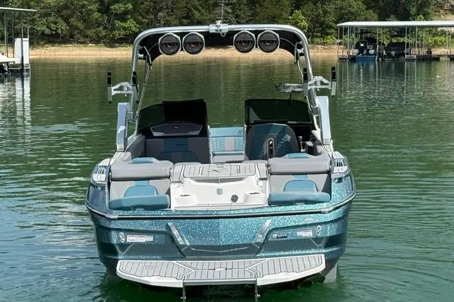 Slide: The Image of 2025 MasterCraft X24 boat on a serene lake, showcasing sleek design and modern features. - 6