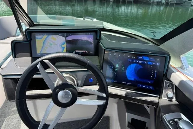 Slide: The Image of 2025 MasterCraft X24 boat dashboard with advanced navigation and control screens. - 9