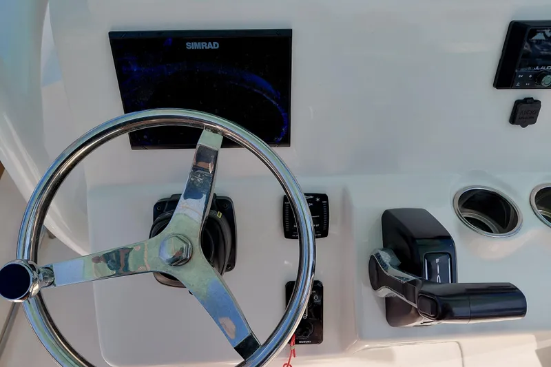 Slide: The Image of Steering console of 2023 Pioneer 220 Bay Sport boat with Simrad display. - 36
