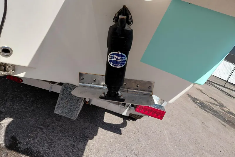 Slide: The Image of Rear view of 2023 Pioneer 220 Bay Sport boat with trim tab and trailer. - 56