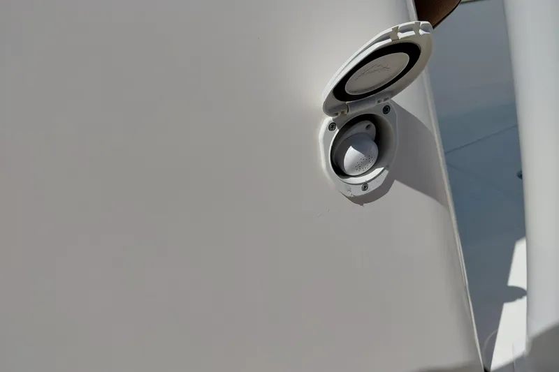 Slide: The Image of 2023 Pioneer 220 Bay Sport boat fuel cap detail in sunlight. - 52