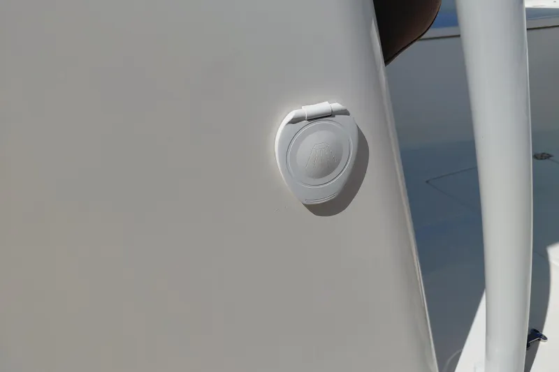 Slide: The Image of 2023 Pioneer 220 Bay Sport boat detail with a closed hatch on the deck. - 53