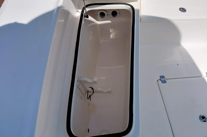 Slide: The Image of Open storage compartment on 2023 Pioneer 220 Bay Sport boat deck. - 16