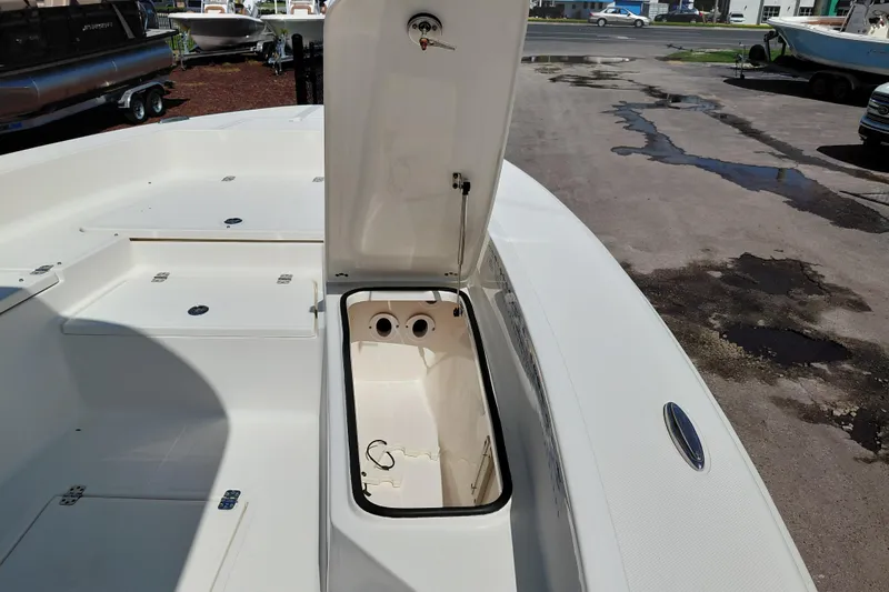 Slide: The Image of Open storage compartment on 2023 Pioneer 220 Bay Sport boat, showcasing interior space. - 14