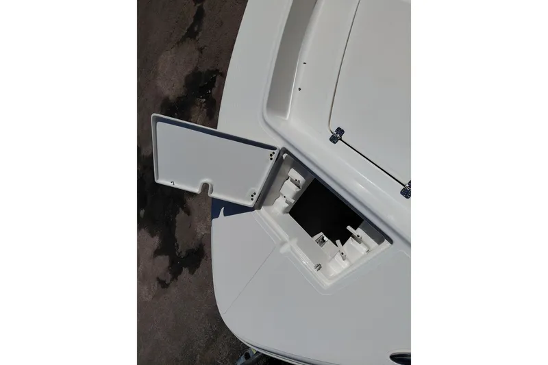 Slide: The Image of Open storage compartment on 2023 Pioneer 220 Bay Sport boat deck. - 10