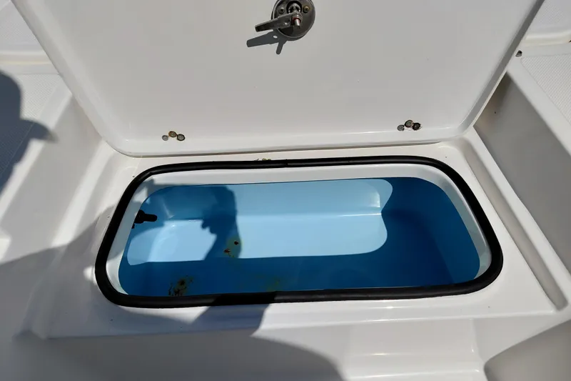 Slide: The Image of Open storage compartment on 2023 Pioneer 220 Bay Sport boat. - 13
