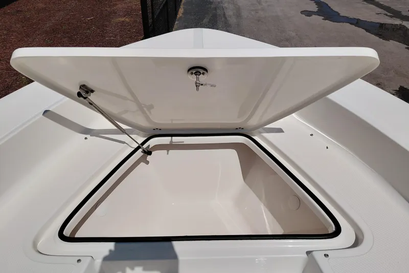 Slide: The Image of Open storage compartment on 2023 Pioneer 220 Bay Sport boat. - 11