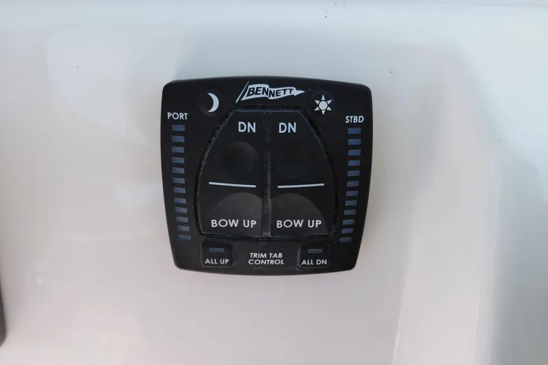 Slide: The Image of Bennett trim tab control panel on 2023 Pioneer 220 Bay Sport boat. - 54