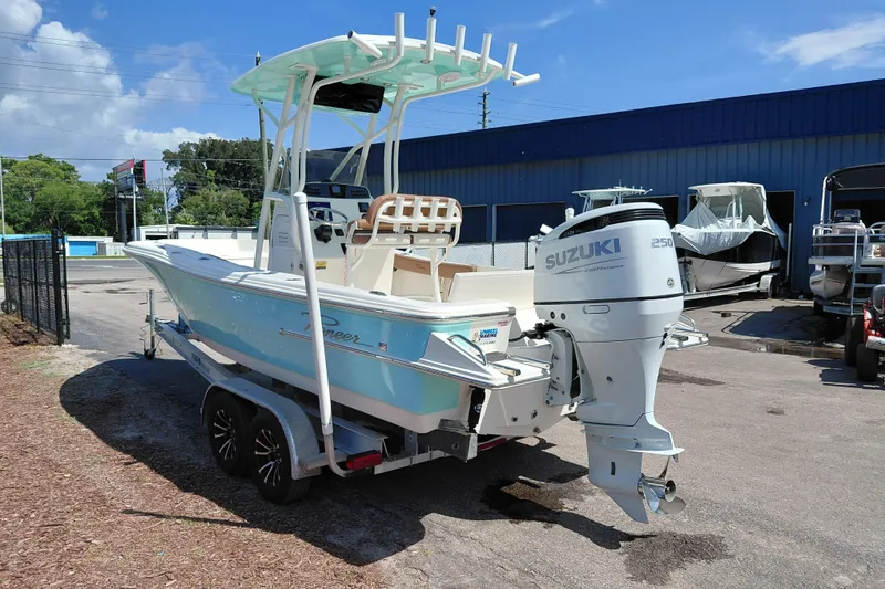 Slide: The Image of 2023 Pioneer 220 Bay Sport boat with Suzuki 250 engine on trailer. - 5