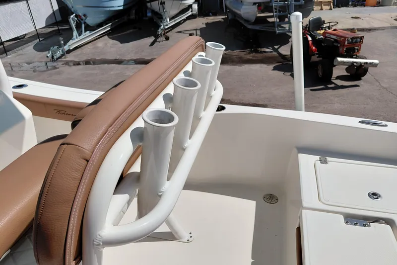 Slide: The Image of 2023 Pioneer 220 Bay Sport boat with rod holders and tan seating. - 40