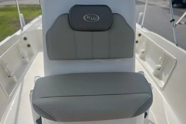Slide: The Image of 2024 Key West 1720 Center Console boat seat with gray cushioning and KW logo. - 8