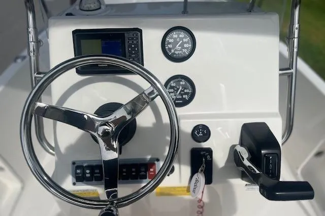Slide: The Image of 2024 Key West 1720 Center Console dashboard with steering wheel and gauges. - 6