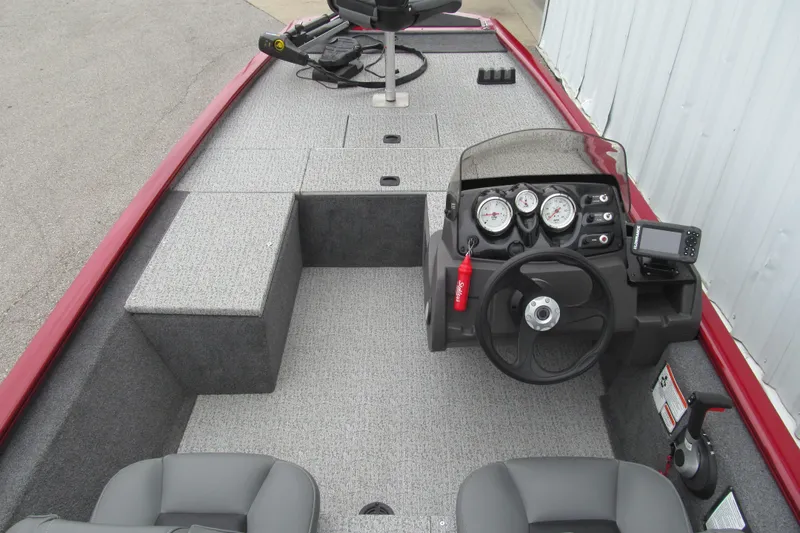 Slide: The Image of 2020 Tracker Pro 170 boat interior with steering console and seating. - 4
