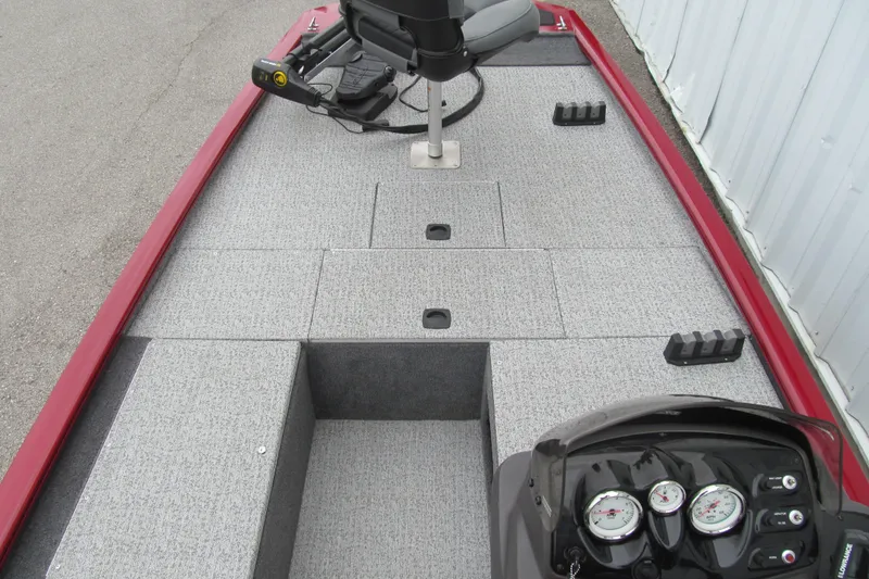 Slide: The Image of 2020 Tracker Pro 170 boat interior with gray carpet and red trim. - 6