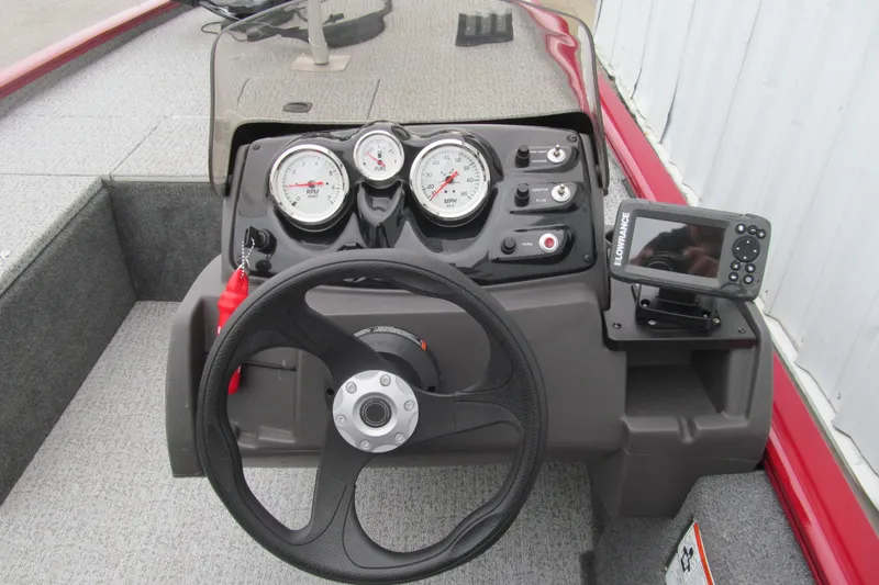 Slide: The Image of 2020 Tracker Pro 170 boat dashboard with gauges and Lowrance fish finder. - 5