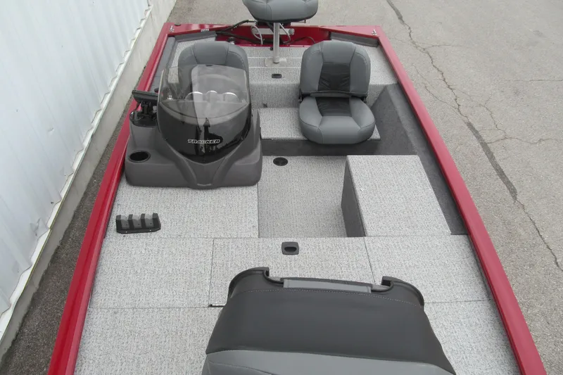 Slide: The Image of 2020 Tracker Pro 170 boat interior with gray seating and red trim. - 10
