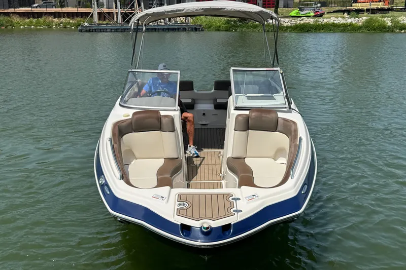 Slide: The Image of 2011 Yamaha Boats 242 Limited on water, featuring spacious seating and sleek design. - 9