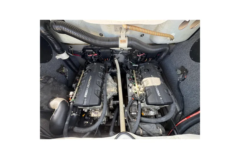 Slide: The Image of Engine compartment of a 2011 Yamaha Boats 242 Limited, featuring dual high-output engines. - 26