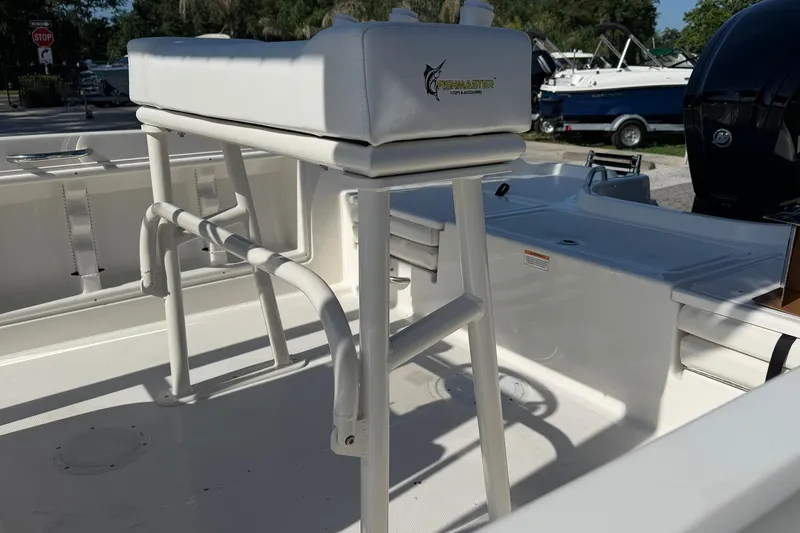 Slide: The Image of 2025 Bayliner Trophy T18 boat interior with Fishmaster leaning post and white seating. - 19