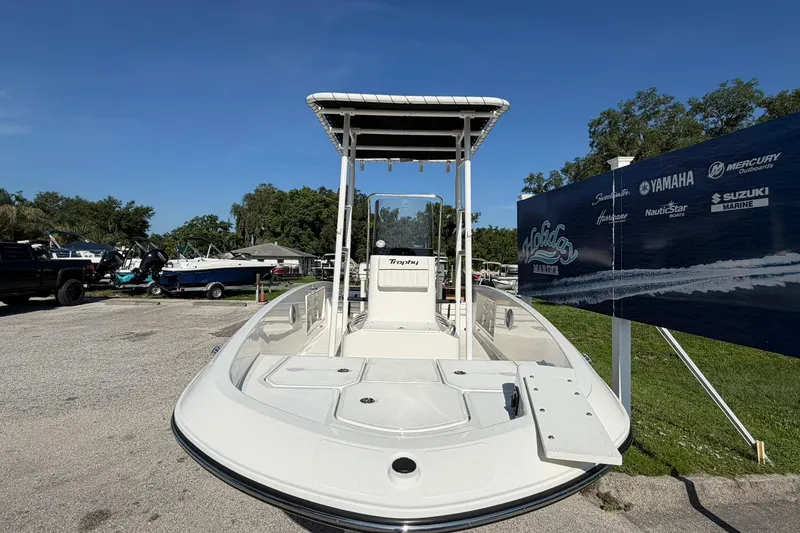 Slide: The Image of 2025 Bayliner Trophy T18 boat displayed outdoors under clear blue sky. - 4