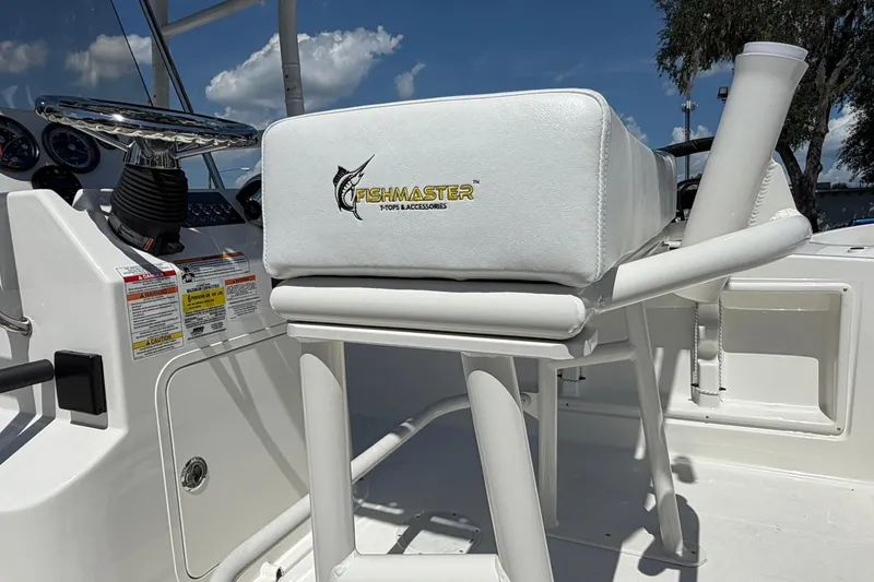Slide: The Image of 2025 Bayliner Trophy T18 boat interior with Fishmaster accessories and steering console. - 18