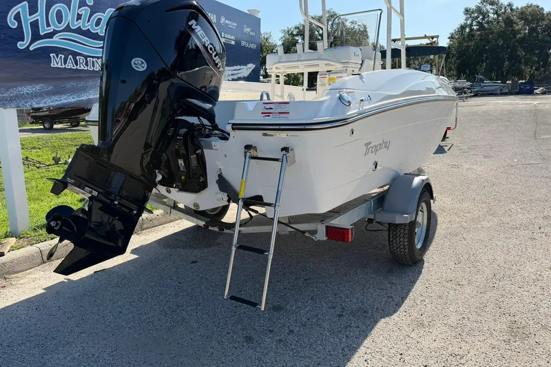 Slide: The Image of 2025 Bayliner Trophy T18 boat with Mercury outboard motor on trailer. - 32