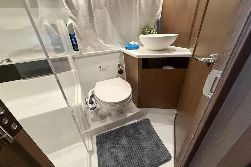 Slide: The Image of Bathroom interior of 2026 Beneteau Antares 11 Coupe, featuring modern fixtures and elegant design. - 29