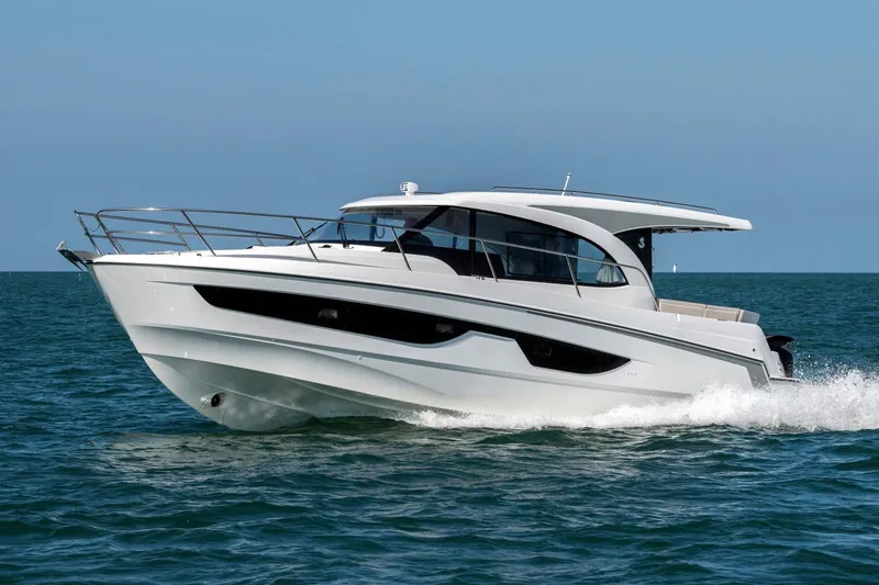 Slide: The Image of Manufacturer Provided Image: 2026 Beneteau Antares 11 Coupe cruising on open water, side view. - 2