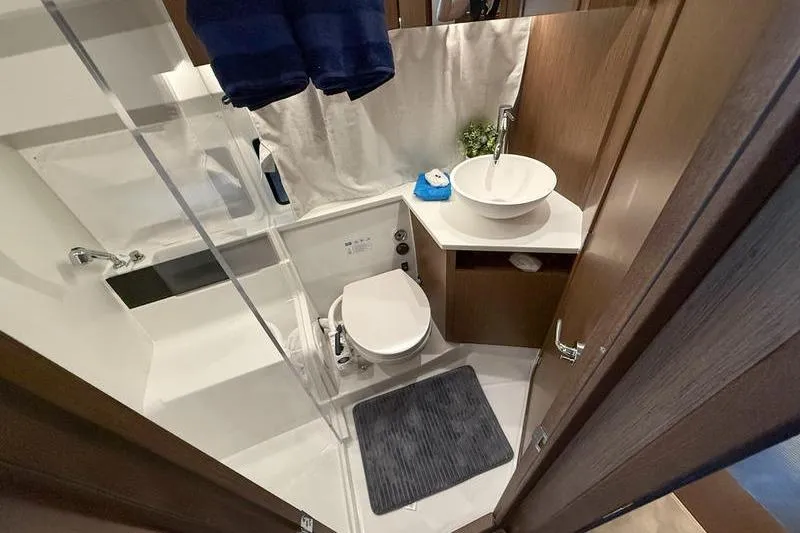 Slide: The Image of Bathroom interior of 2026 Beneteau Antares 11 Coupe, featuring modern fixtures and compact design. - 28