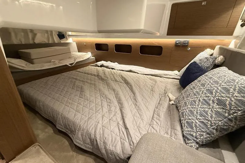 Slide: The Image of Luxurious cabin interior of 2026 Beneteau Antares 11 Coupe with cozy bedding. - 31