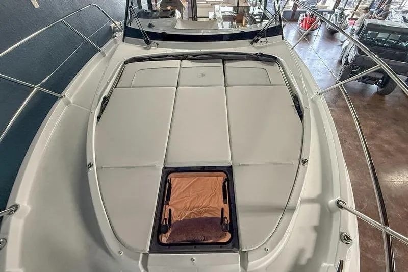 Slide: The Image of 2026 Beneteau Antares 11 Coupe boat deck with cushioned seating and hatch. - 6