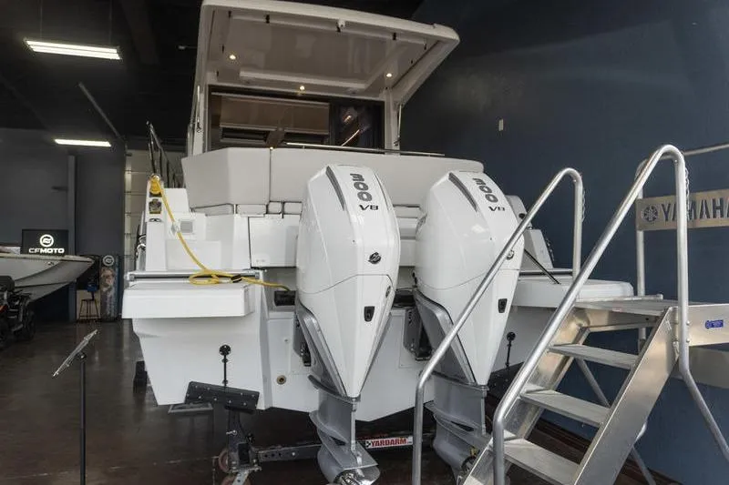 Slide: The Image of 2026 Beneteau Antares 11 Coupe with twin 300 V8 engines in showroom. - 4