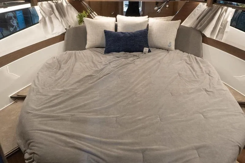 Slide: The Image of Luxurious cabin interior of 2026 Beneteau Antares 11 Coupe with cozy bedding and cushions. - 25