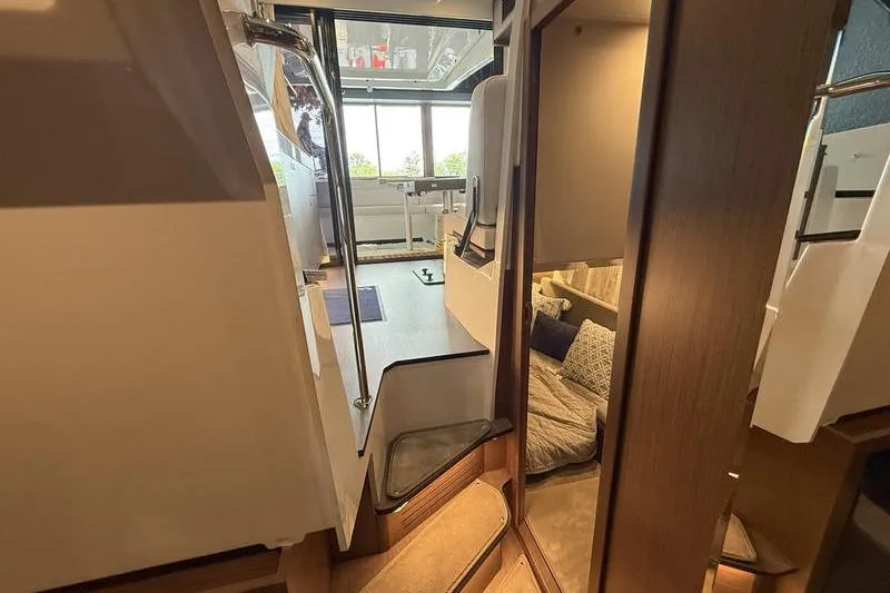 Slide: The Image of Interior of 2026 Beneteau Antares 11 Coupe, featuring modern design and cozy seating area. - 30