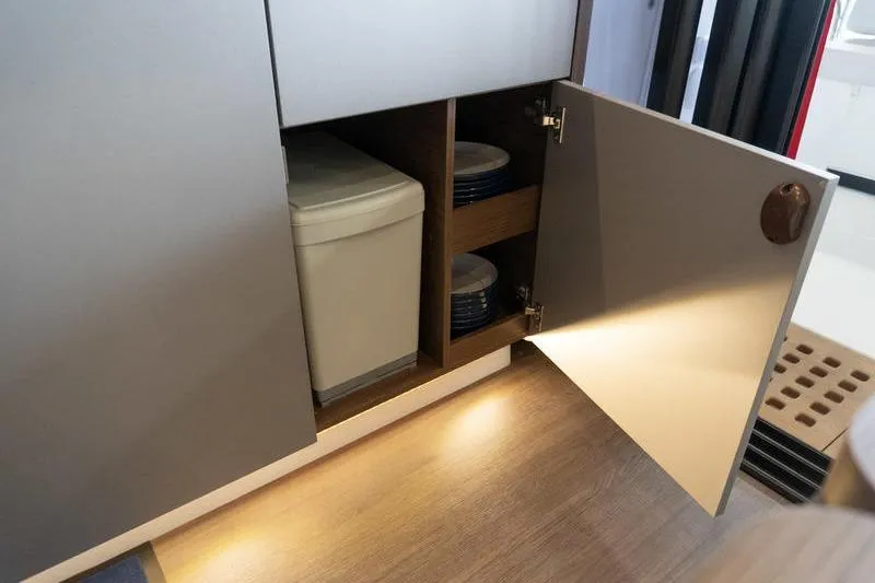 Slide: The Image of Interior storage cabinet in 2026 Beneteau Antares 11 Coupe yacht, featuring organized shelving. - 16