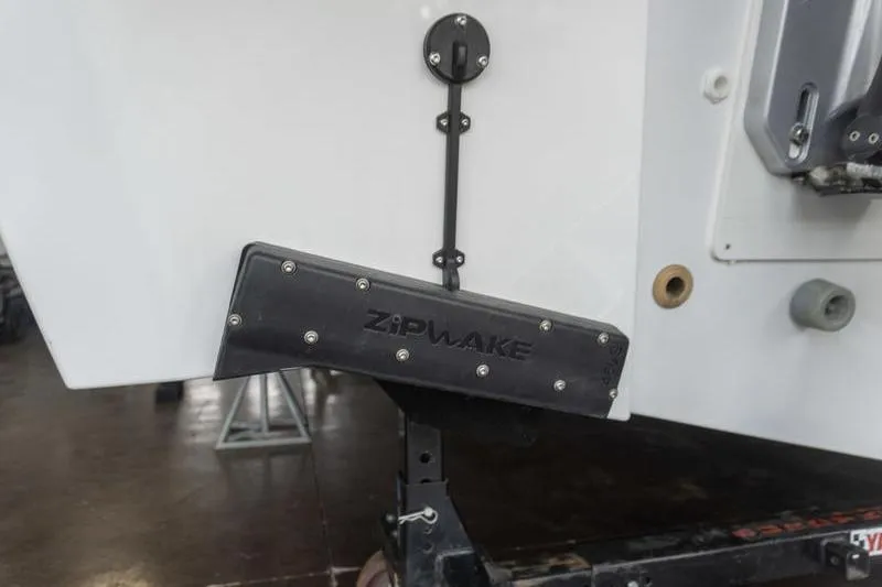 Slide: The Image of Close-up of Zipwake trim system on 2026 Beneteau Antares 11 Coupe boat. - 5